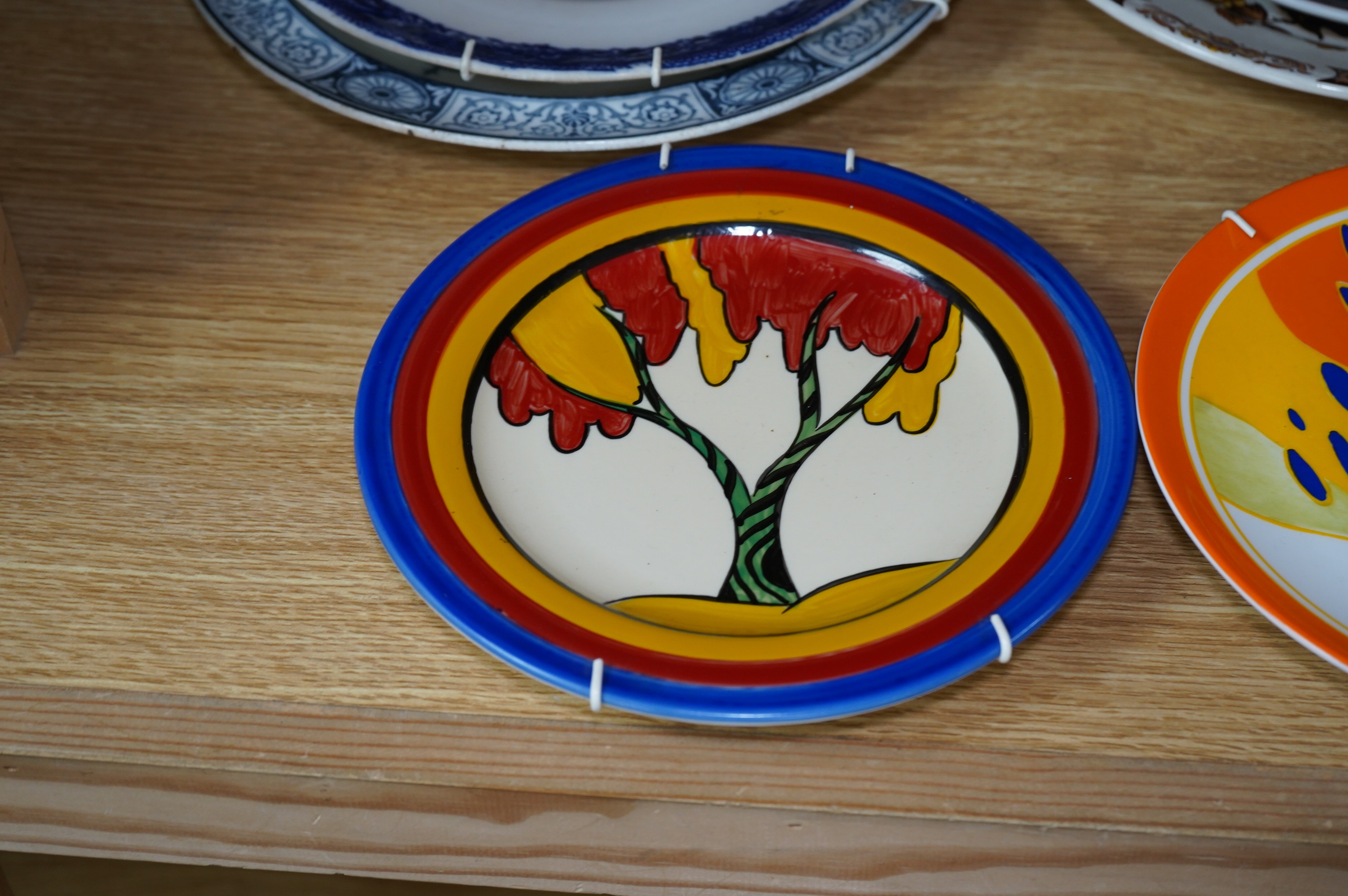 Nine various decorative wall plates including a Wedgwood limited edition ‘Windbells’ in the Bizarre living landscapes of Clarice Cliff plate, Chelsea Works Burslem, Limoges etc. Condition - mostly fair to good